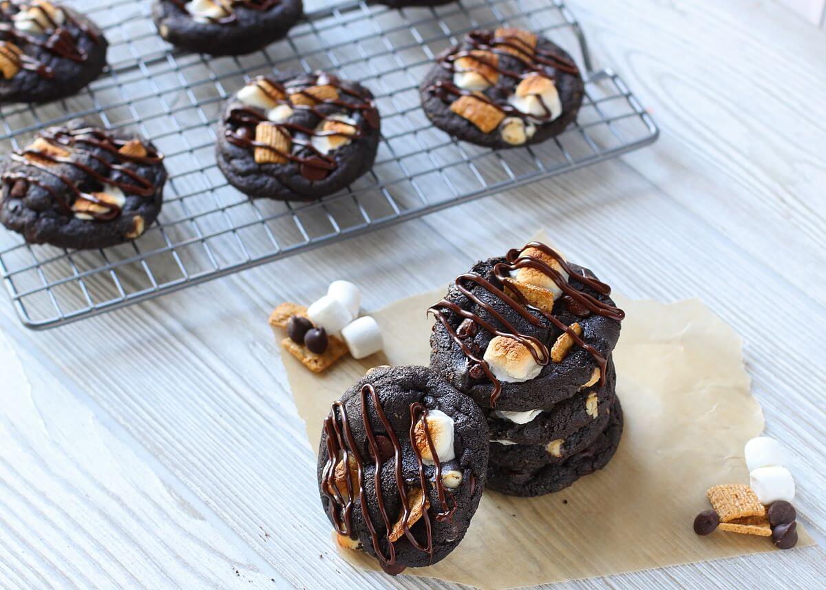 Triple Chocolate S'mores Cookies with marshmallows graham crackers and a glass of milk