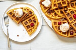 Belgian Cookie Dough waffles topped with homemade whipped cream